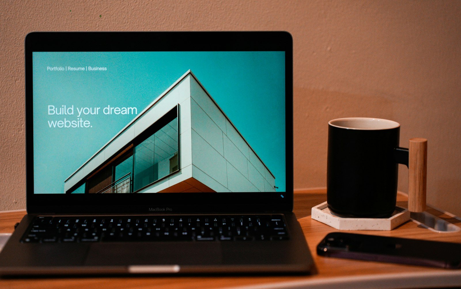 professional keynote speaker website design on macbook laptop showing clean modern layout