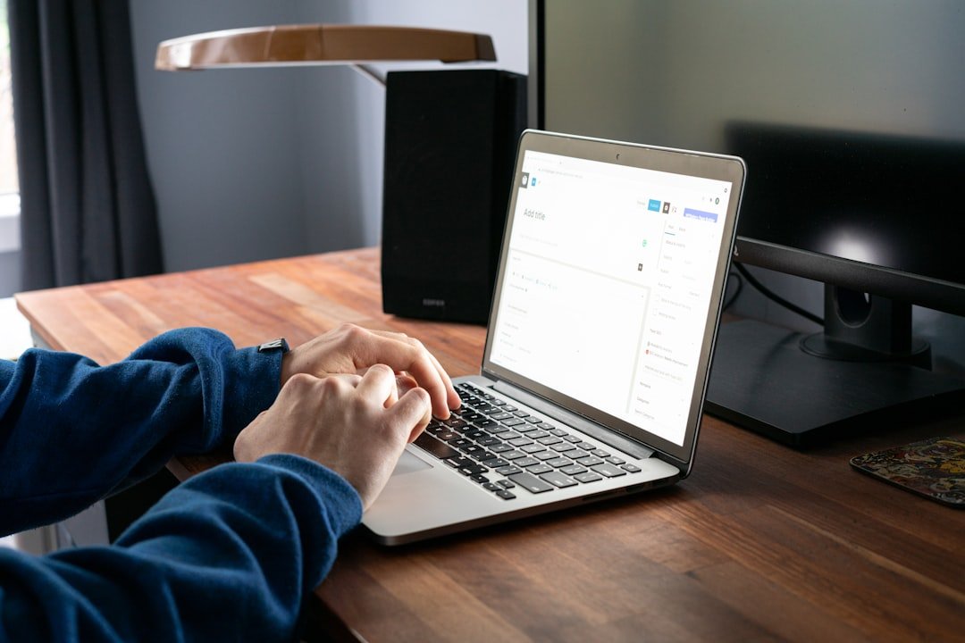 keynote speaker creating SEO content on MacBook laptop for website
