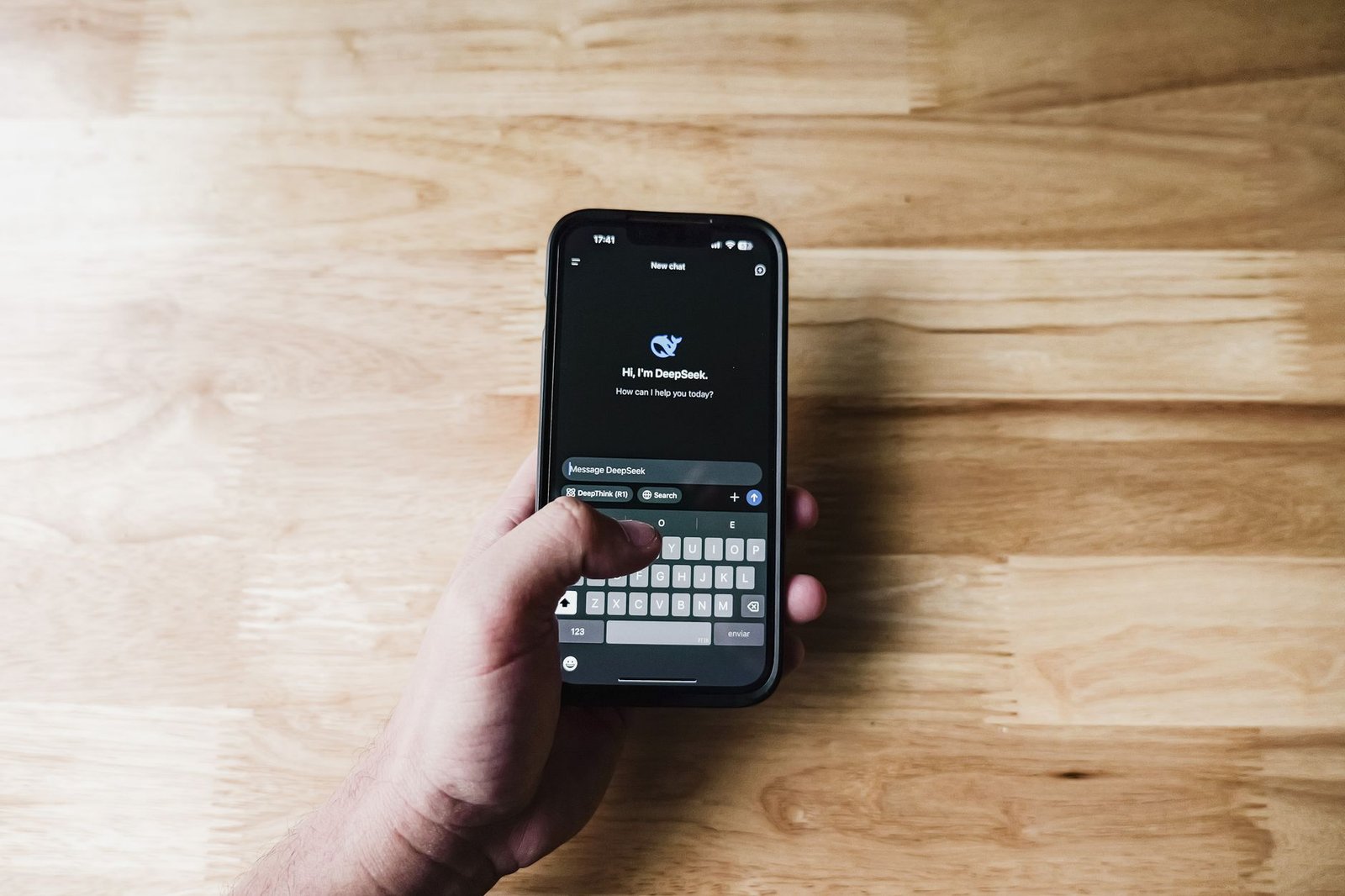 person asking an AI assistant on smartphone for keynote speaker recommendations representing the discovery stage of the organizer search