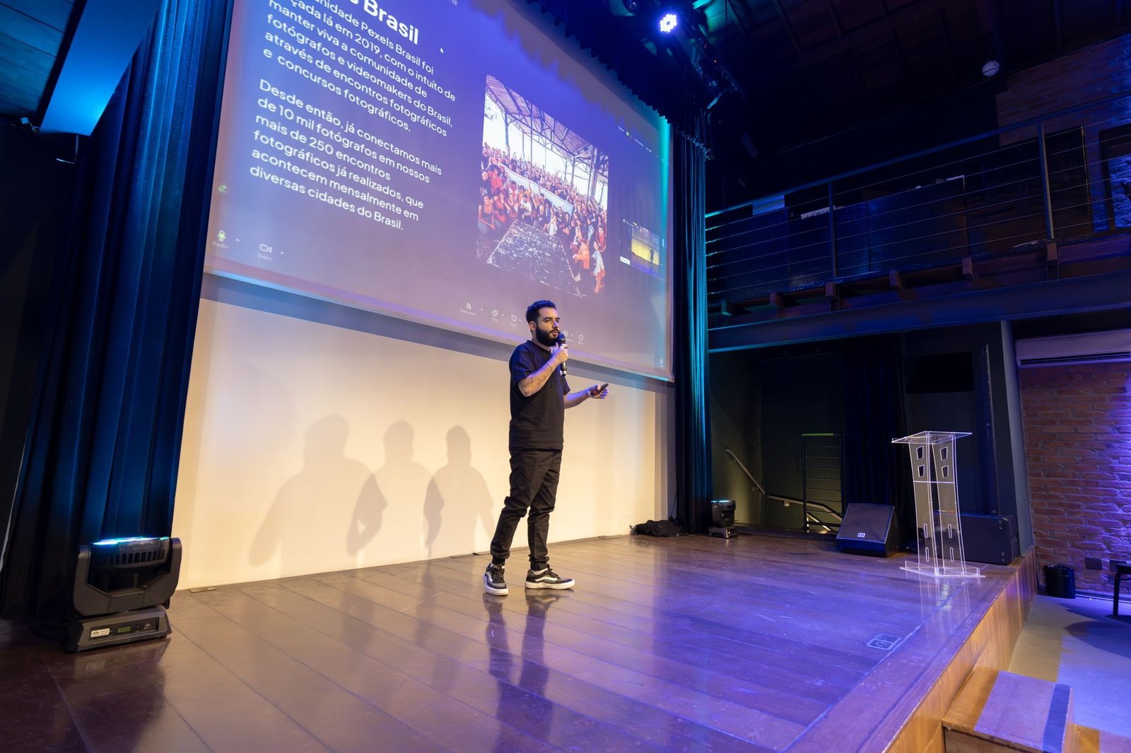 keynote speaker presenting at a conference with projected slide representing the keynote topic pages that get speakers booked