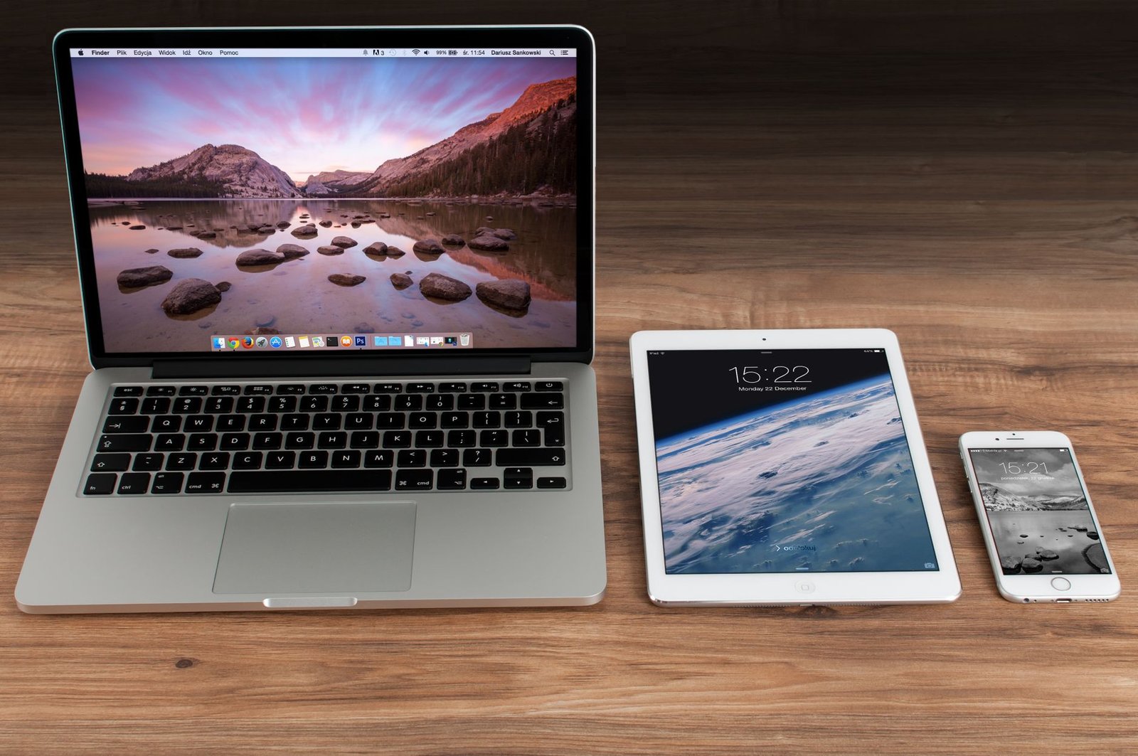laptop tablet and smartphone on a desk showing a responsive speaker website layout adapting across devices