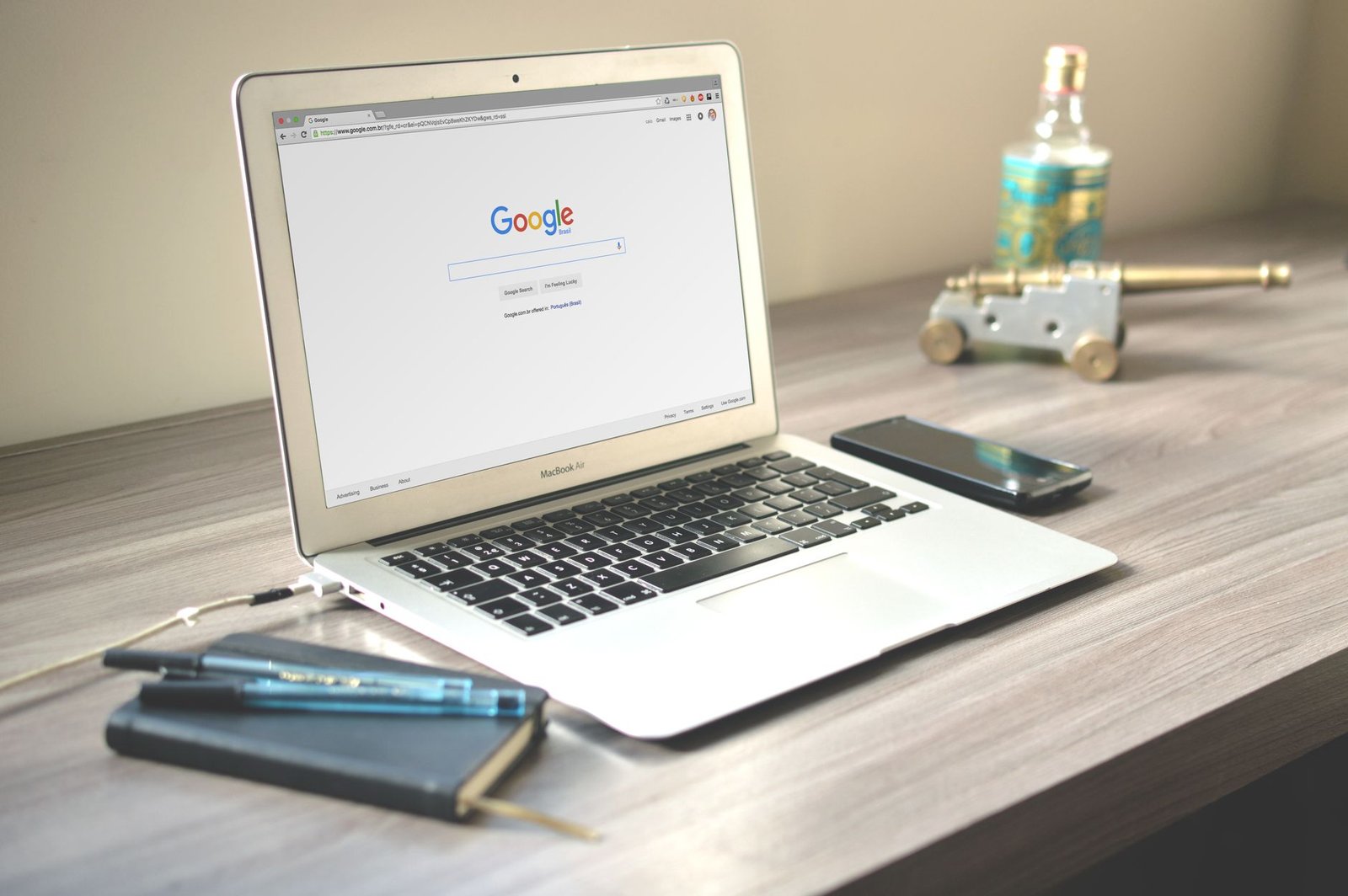 neat workspace with laptop displaying Google search results representing SEO for keynote speaker website strategy