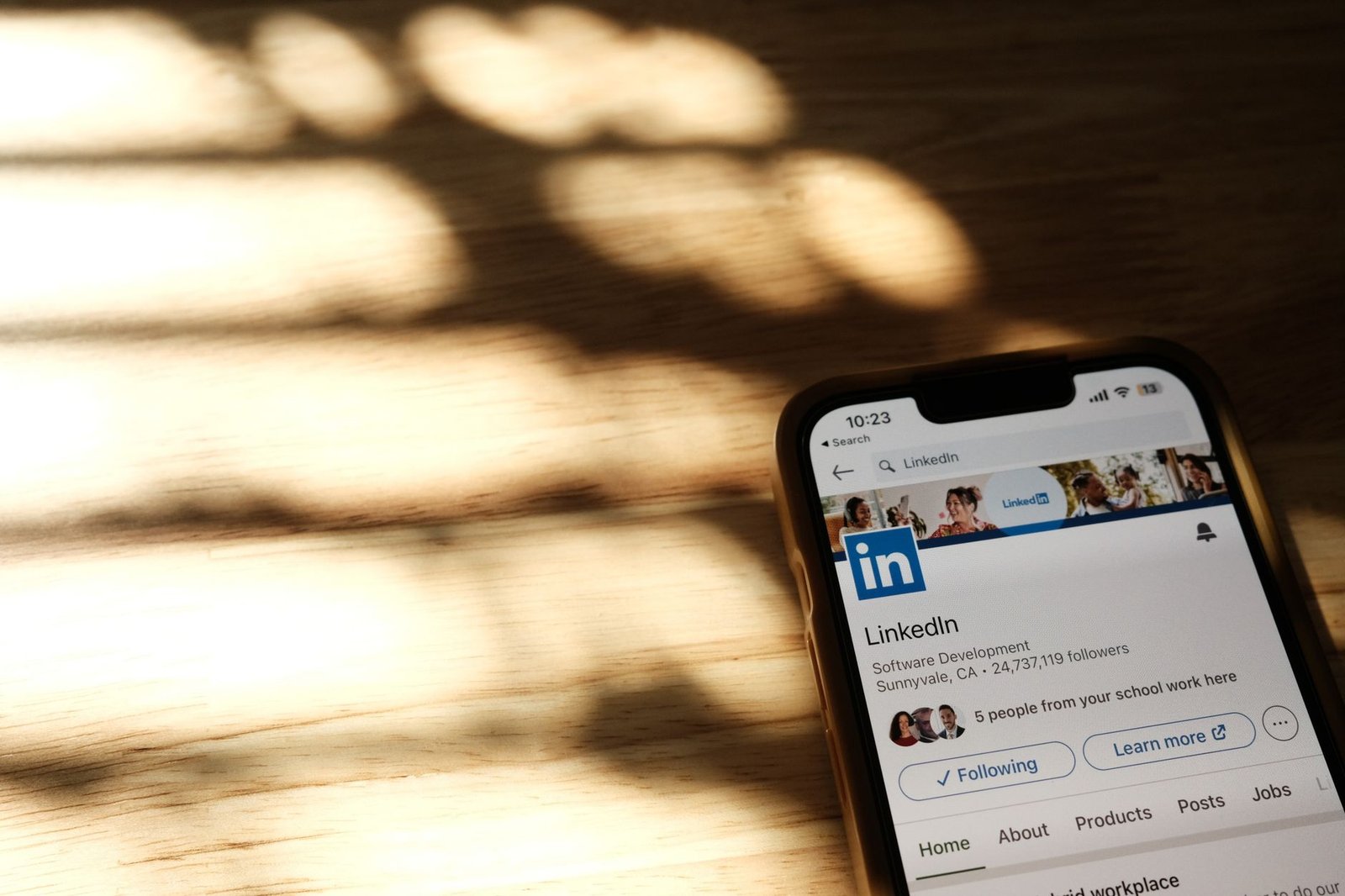 smartphone displaying LinkedIn profile page representing a keynote speaker who gets booked through LinkedIn