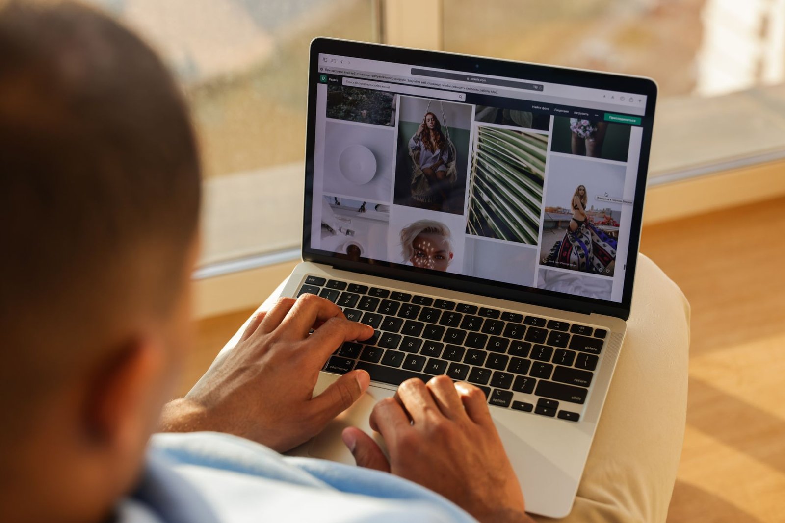 speaker reviewing keynote speaker website designer portfolio examples on laptop in professional setting