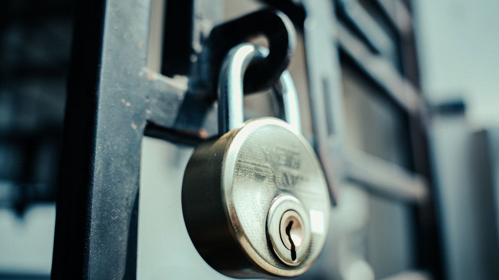steel padlock securely fastened on a gate representing the ownership and security considerations of an AI generated website versus a custom WordPress build