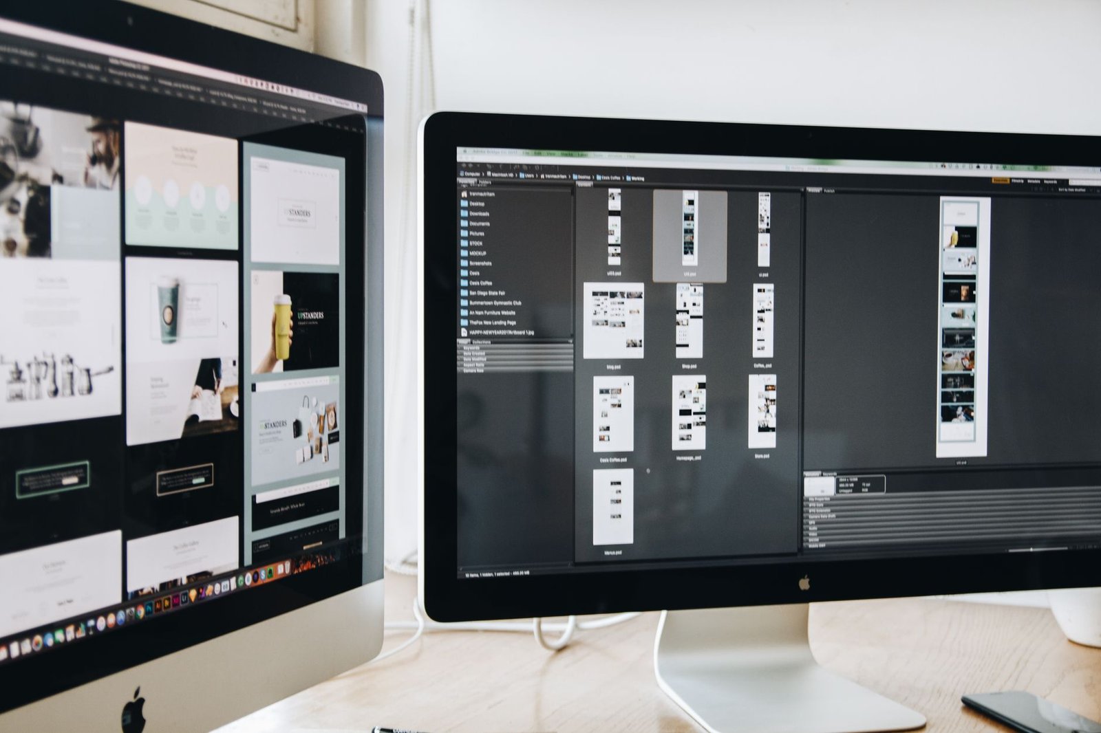 modern workspace with dual monitors showing web design projects representing a keynote speaker website redesign in progress