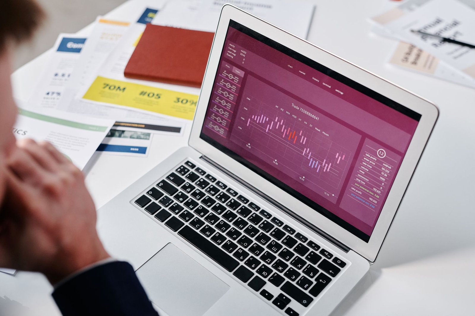 professional reviewing website analytics on laptop representing measurable booking results after a speaker website redesign
