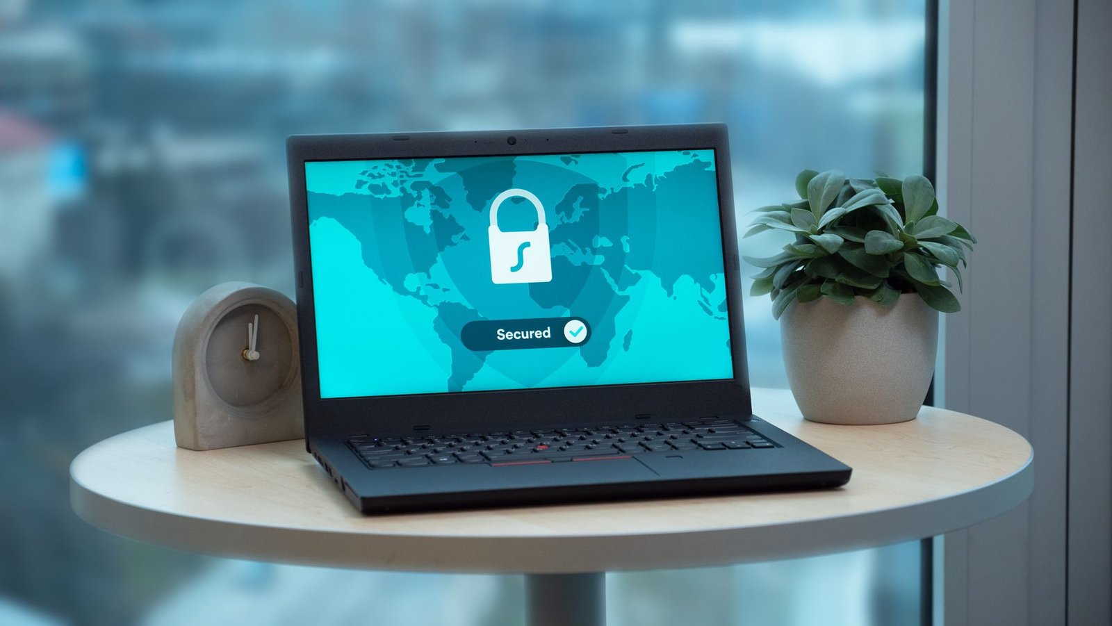laptop displaying a security lock icon on a desk representing the real security vulnerabilities documented in AI-generated website code